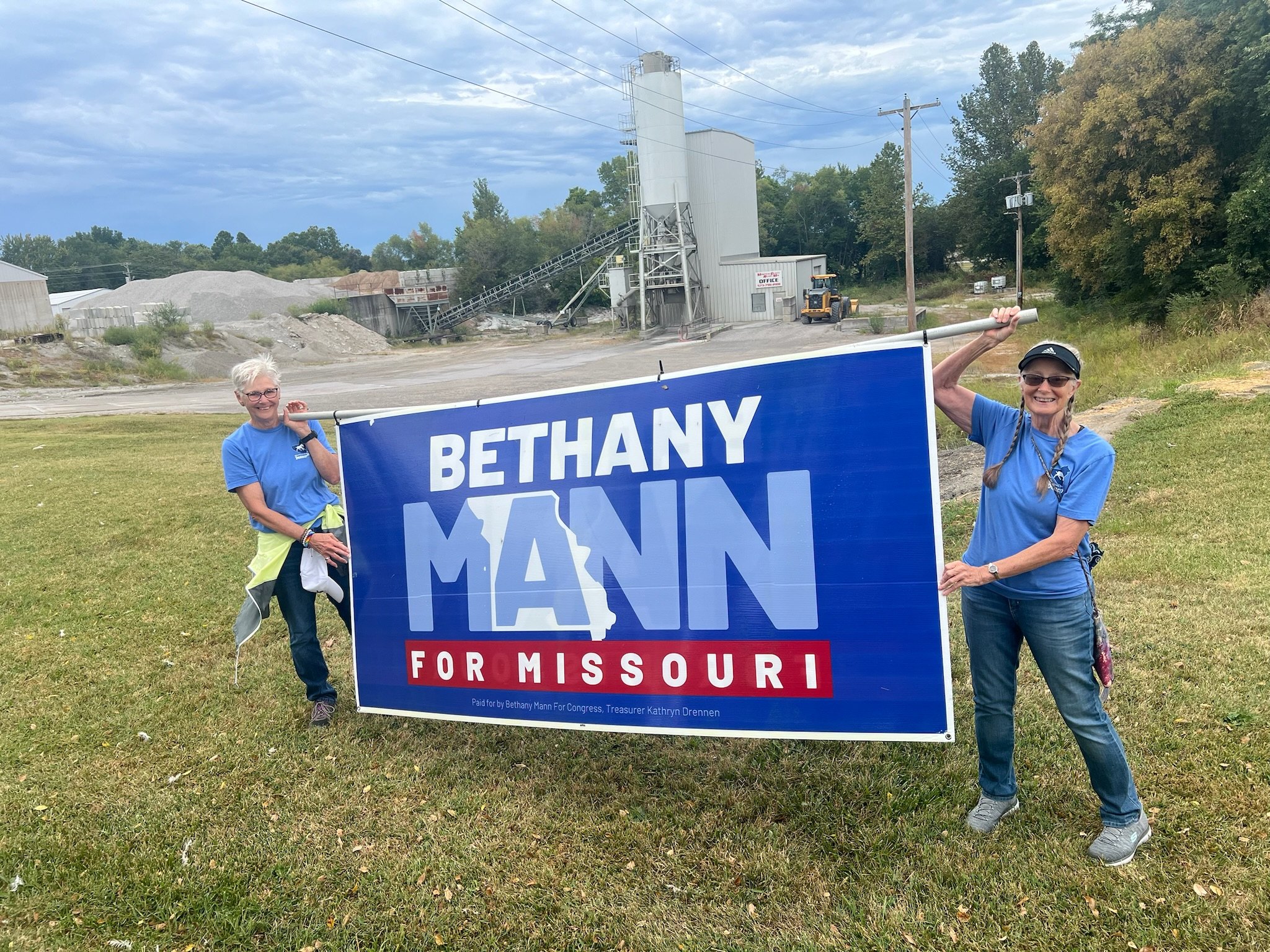 Campaign volunteers holding a Bethany Mann for Missouri banner